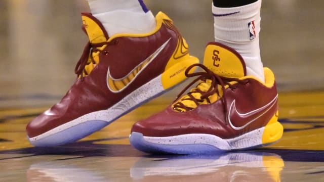 LeBron James' cardinal and gold Nike sneakers.